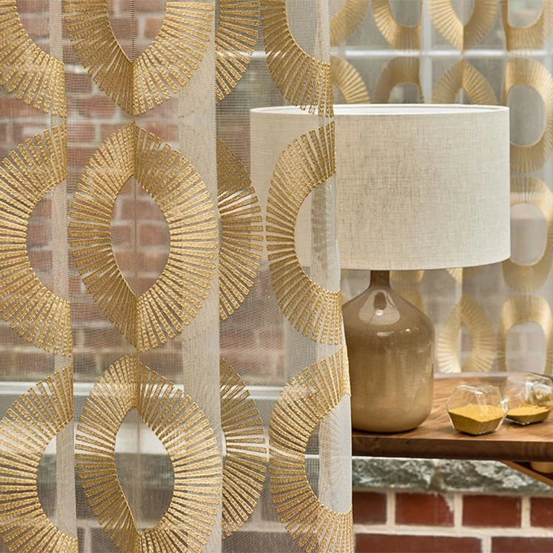 Aura – moderne transparente Gardine nach Maß mit edler Art-Déco Kreisstickerei, gold silber